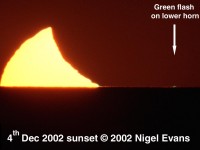 Green flash on lower horn of setting Sun